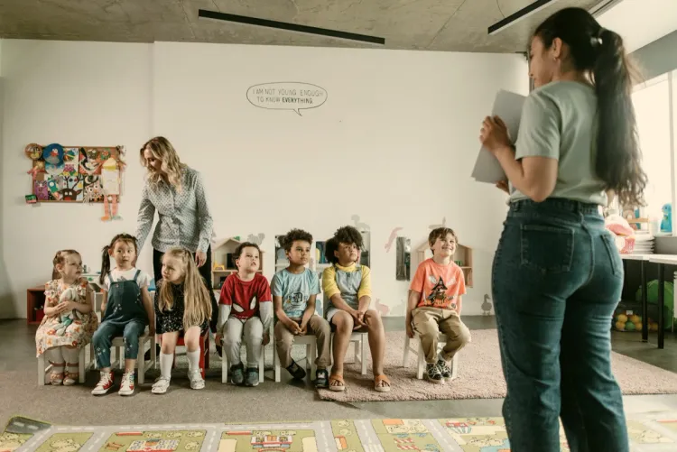 Diverse group of children with their teachers in the classroom
