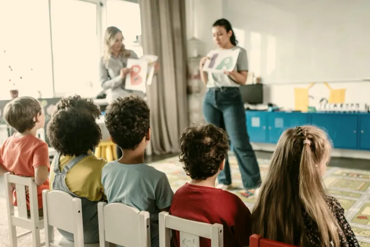 Pre-K children learning letters with their teachers